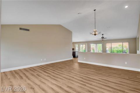 This expansive living area offers bright views and durable flooring, perfect for comfortable living. This expansive living area offers bright views and durable flooring, perfect for comfortable living.