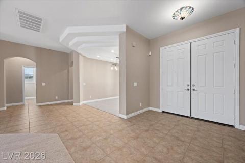 Step into this luminous entry, flowing seamlessly into adjoining living spaces.