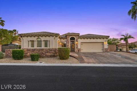 Architectural splendor, stone accents and a paver driveway define this striking residence.