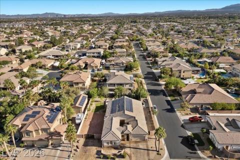 An aerial perspective reveals a sprawling residential community beneath a clear sky.