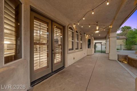 A well-lit covered patio offers ample space for outdoor enjoyment.