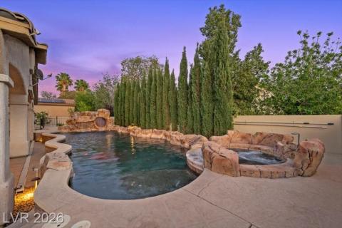 A private oasis awaits with a custom-designed pool and integrated spa, perfect for relaxation or entertaining.