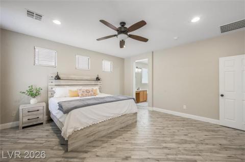 Primary bedroom with wood tile flooring Primary bedroom with wood tile flooring