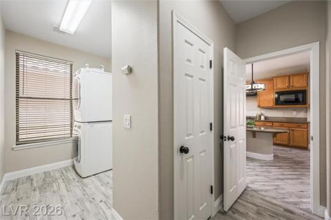 Laundry room with stacked washer/dryer that leaves room for an additional fridge! Laundry room with stacked washer/dryer that leaves room for an additional fridge!