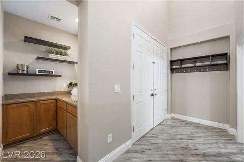 Greet your guests with drinks from this functional wet bar is located by the front door and formal dining room Greet your guests with drinks from this functional wet bar is located by the front door and formal dining room