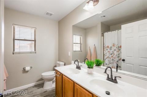 Upstairs bathroom with double sinks and tub/shower Upstairs bathroom with double sinks and tub/shower