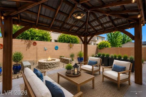 Backyard with pergola with ceiling fan and built in fire-pit Backyard with pergola with ceiling fan and built in fire-pit