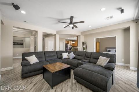 Large family room space with ceiling fan. Large family room space with ceiling fan.
