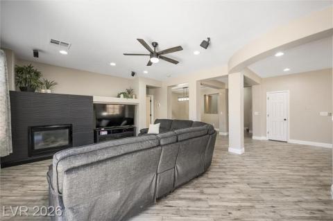 Family room with gorgeous black tile feature wall and pot shelves. Family room with gorgeous black tile feature wall and pot shelves.