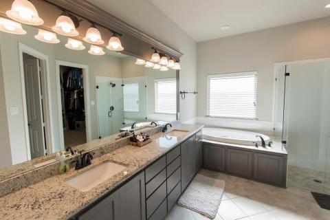 Expansive master bath with room for more than one person to get ready