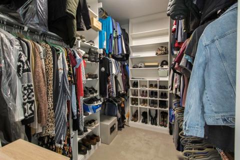 Master closet fit for a king and queen. Plenty of room to share