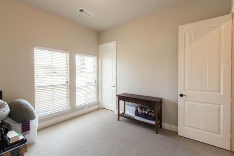 Sunny bedroom faces the front of the house. Upgraded panel doors