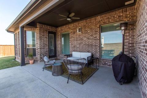 Covered portion of patio with ceiling fan to keep cool
