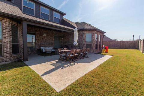 Partially covered extended patio with gas connection for grill. Lots of room for entertaining