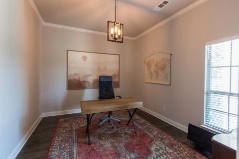 Sunny office with french doors is at the front of the home