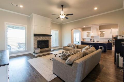 Unified living and kitchen make it easy to prepare food while keeping and eye on the family