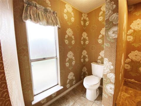 master bath #2 - walk-in closet, shower and toilet along with mile-long vanity