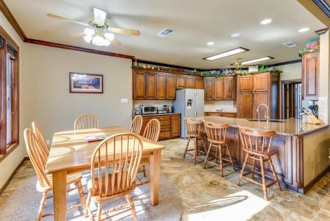 Dining area has view of pool and runway.