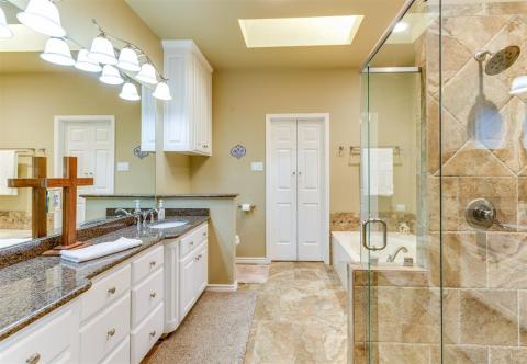 Master bath boasts a double tiled shower and granite counters. Nice sized Master closet with builtin storage.